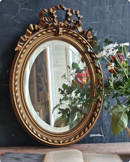 Ancien miroir ovale biseauté style Louis XVI